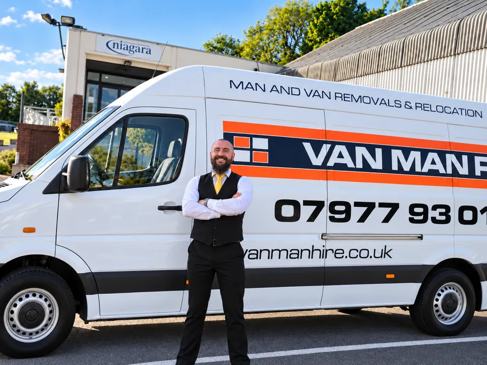 Mark Ravenhill beside a branded Van Man Hire removals van in Sheffield